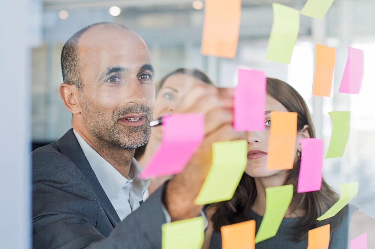 Team brainstorming on Social Media Stratergy with sticky notes