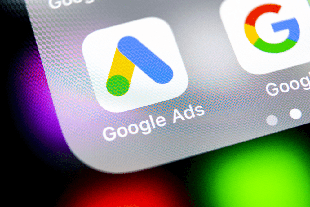 A close up of the google ads logo on an iphone.